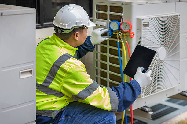 Professional Air Duct Cleaning technician working in Ionia, MI